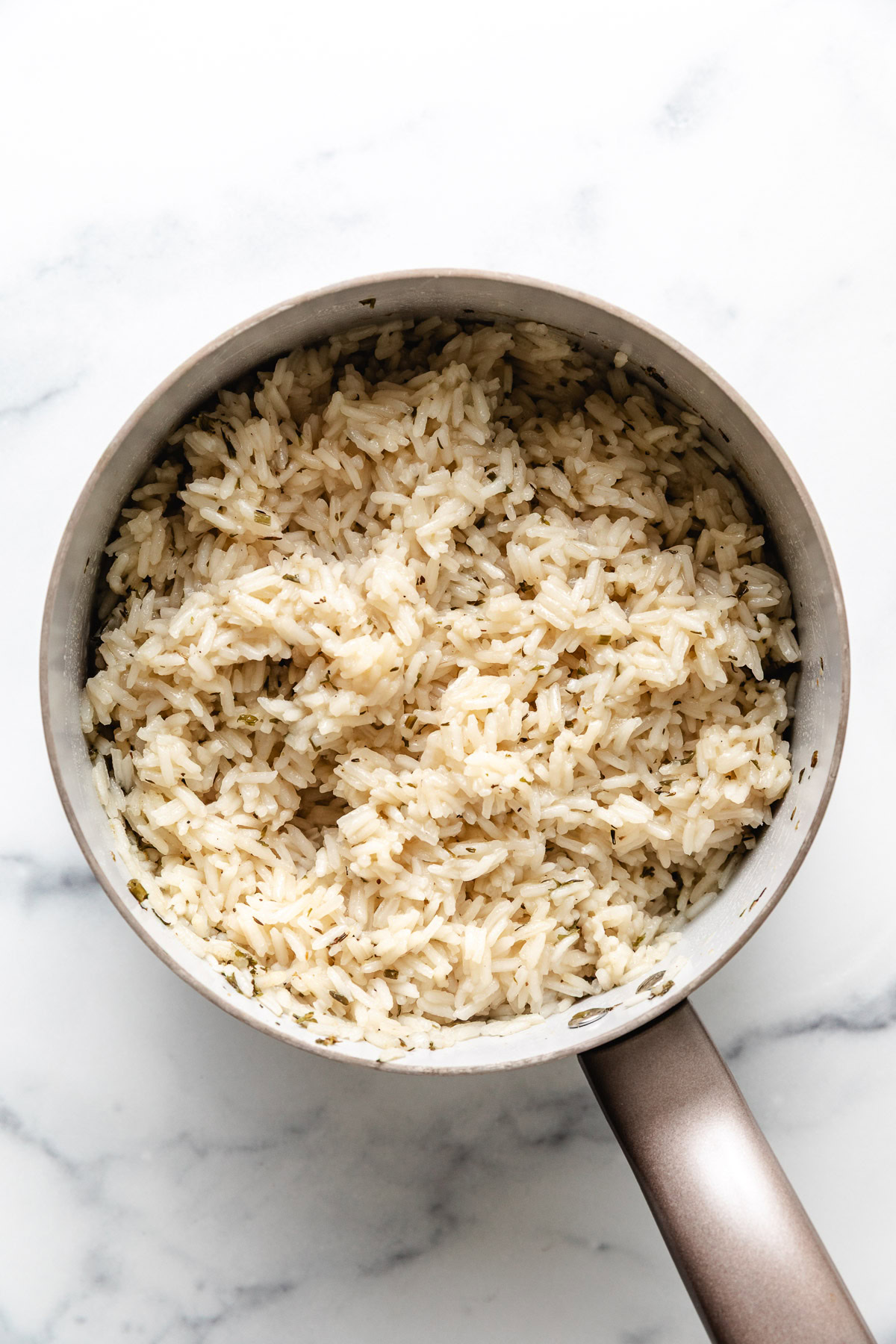 Saucepan filled with herb rice.
