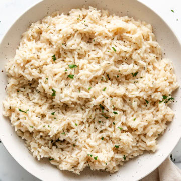 Close up of a bowl of herb rice.