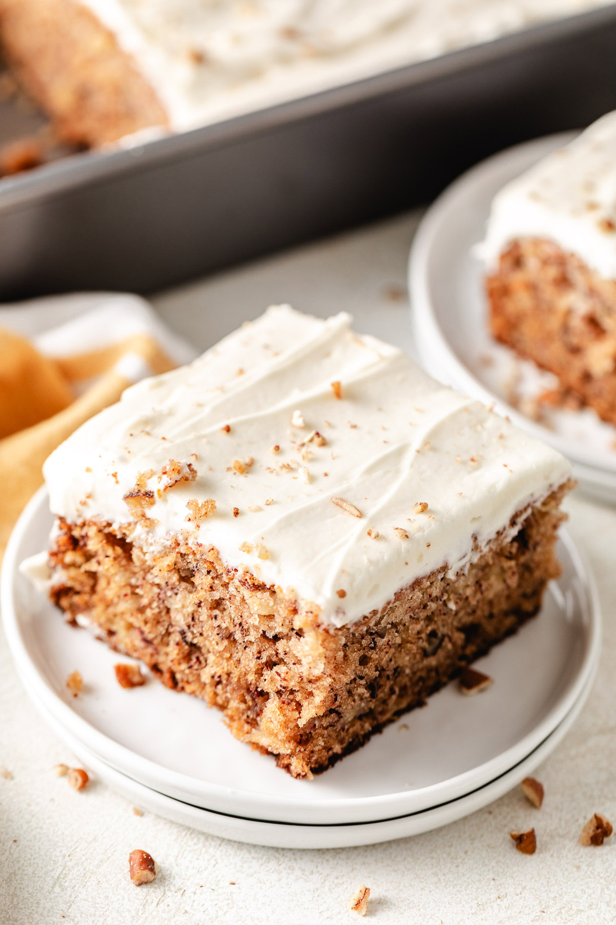 Hummingbird Cake Chopped pecans on hummingbird cake.