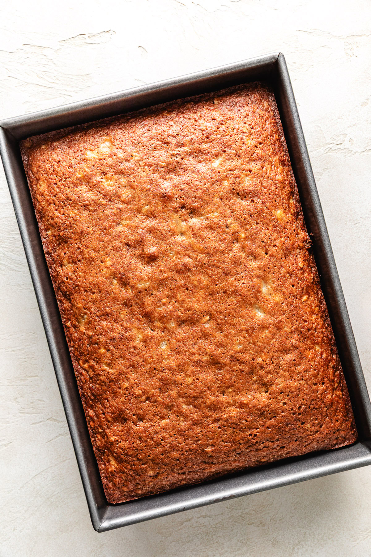 Hummingbird Cake Unfrosted cake in a bowl.