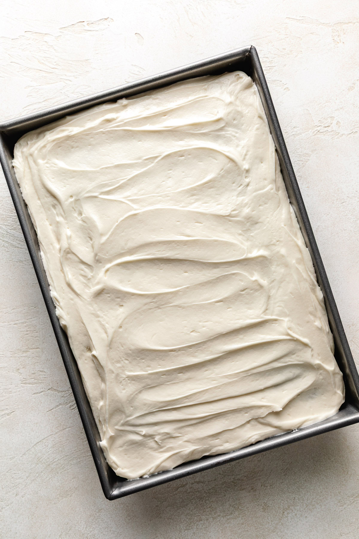 Hummingbird Cake Cream cheese frosting on cake.