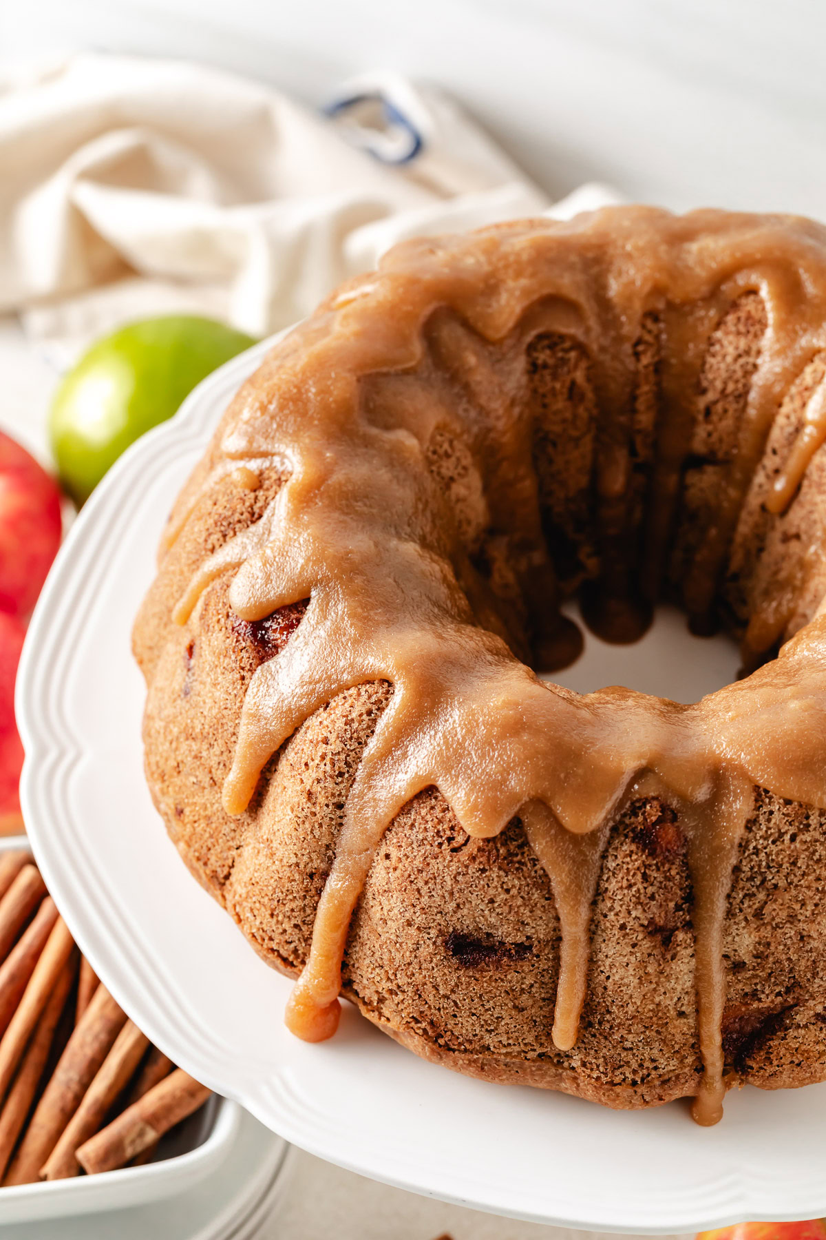 Apple nut bundt cake on a cake stand.