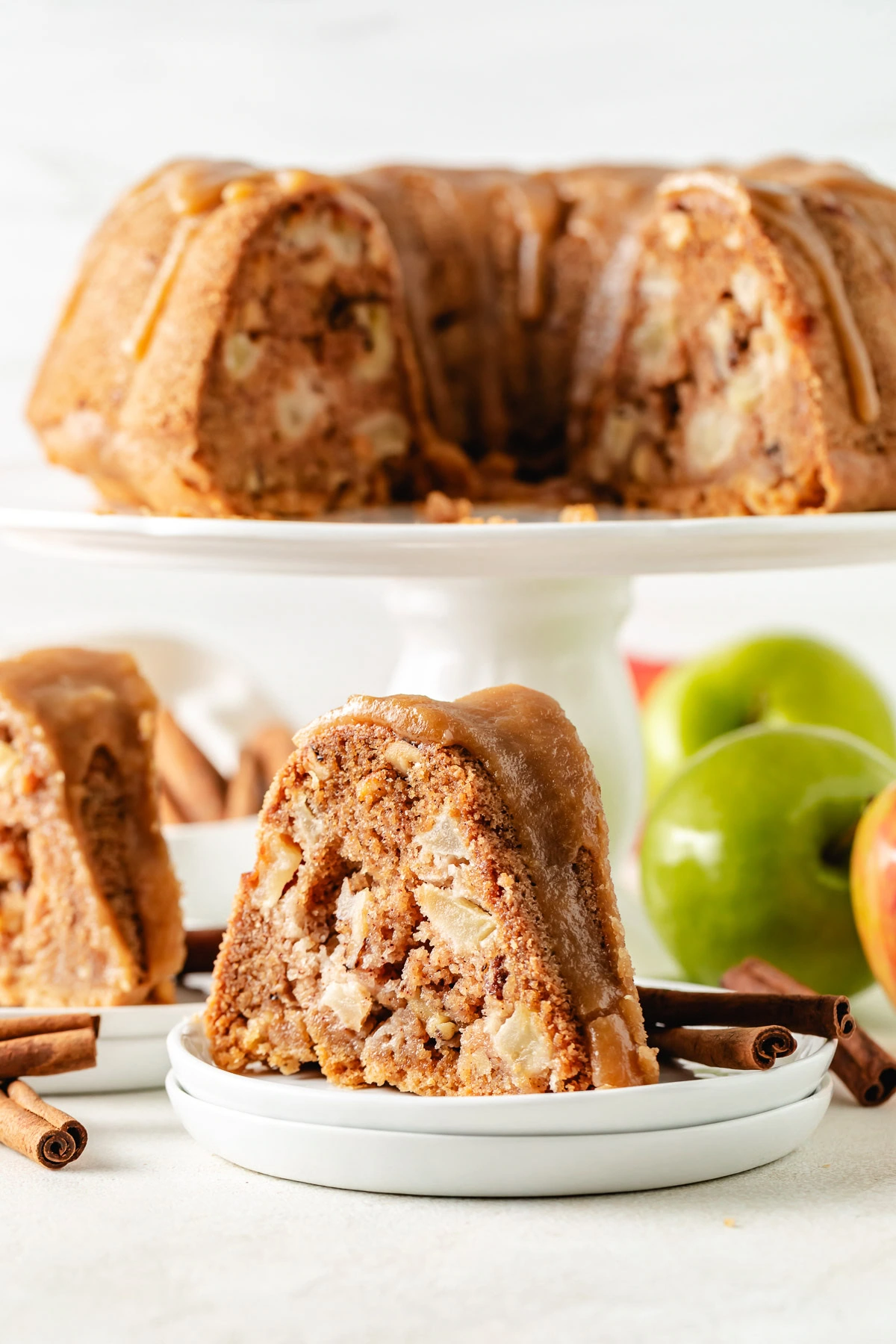 Apple nut cake on a white dish.