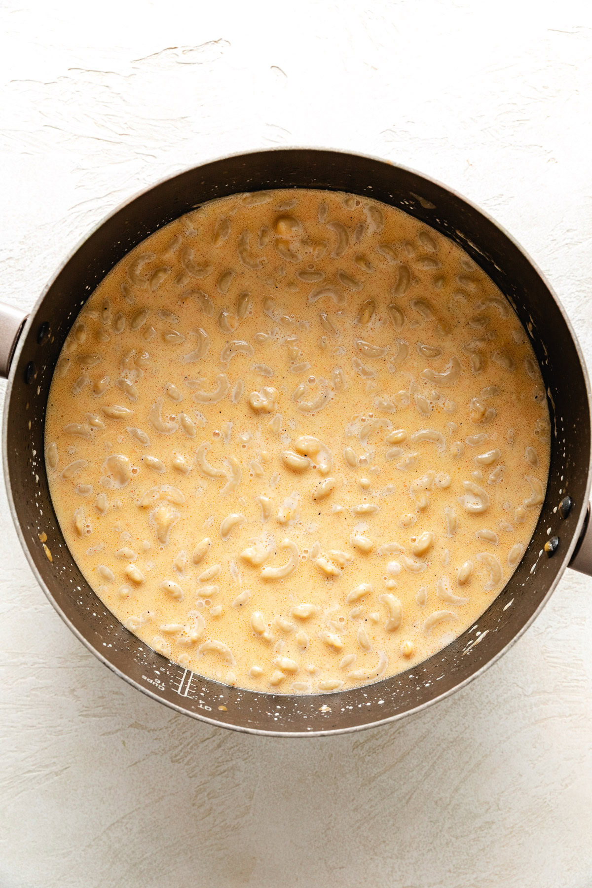 Elbow noodles mixed with cheesy custard.