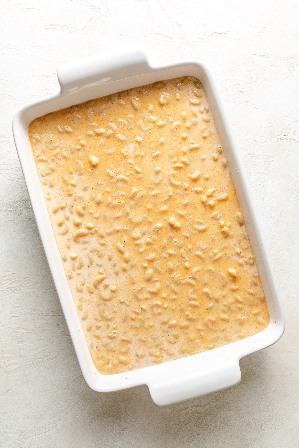 Unbaked mac and cheese in a pan