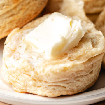 Close up view of butter on a homemade biscuit.