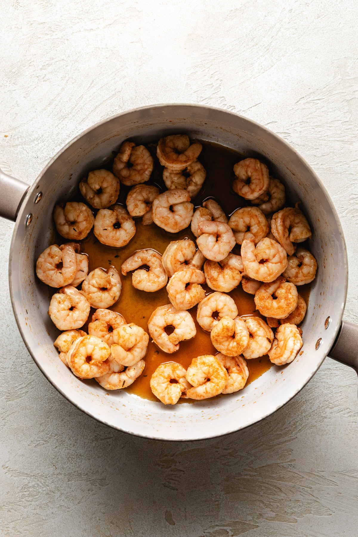 Cooked shrimp in a pan.