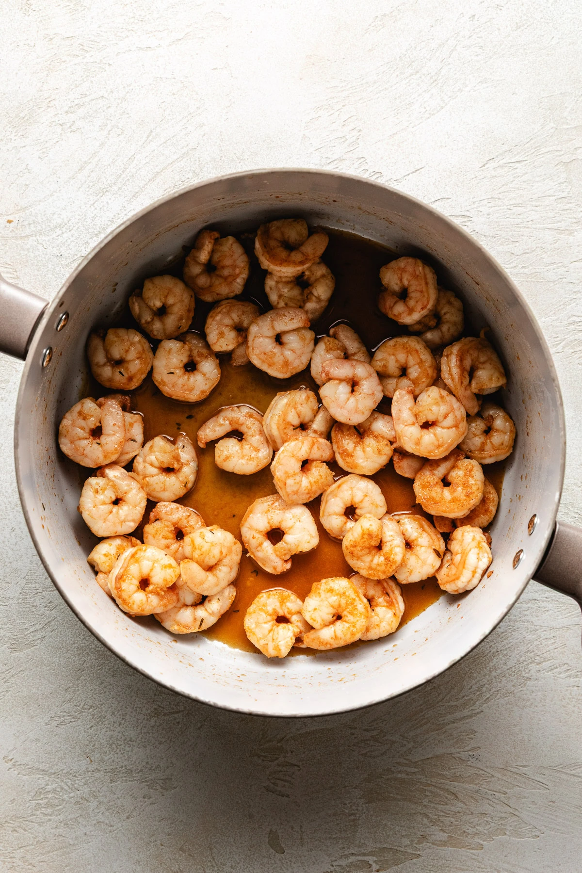 Cooked shrimp in a pan.