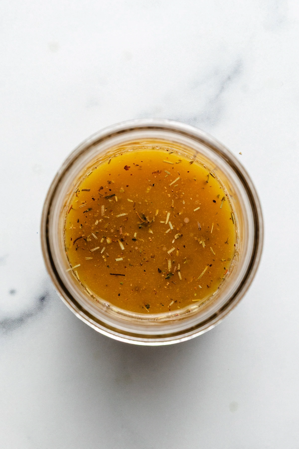 Overhead view of mixed salad dressing.