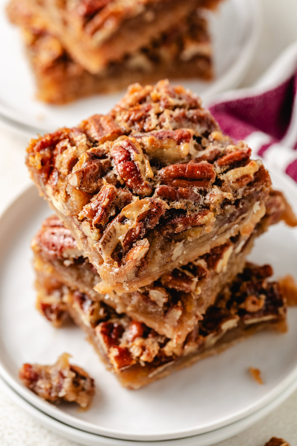 Pecan pie bars on plates.