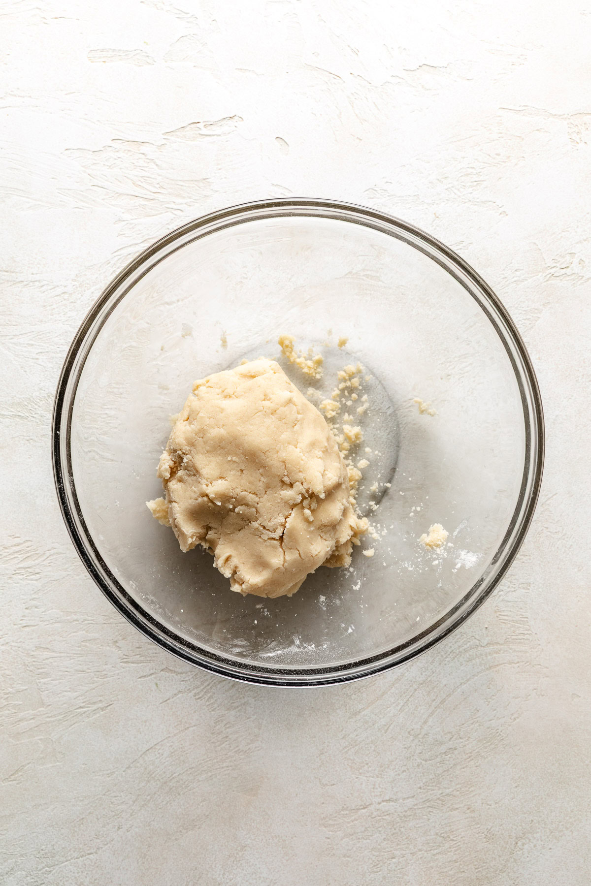 Unbaked pie crust in a bowl.