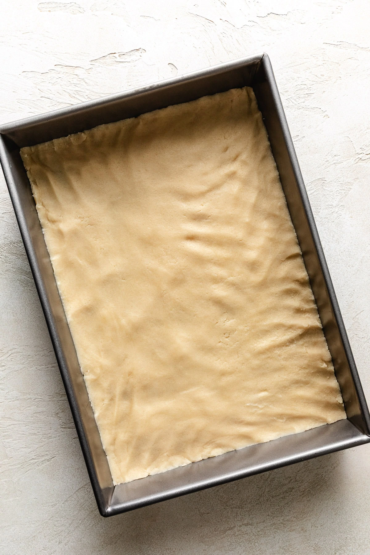 Unbaked pie crust in a pan.