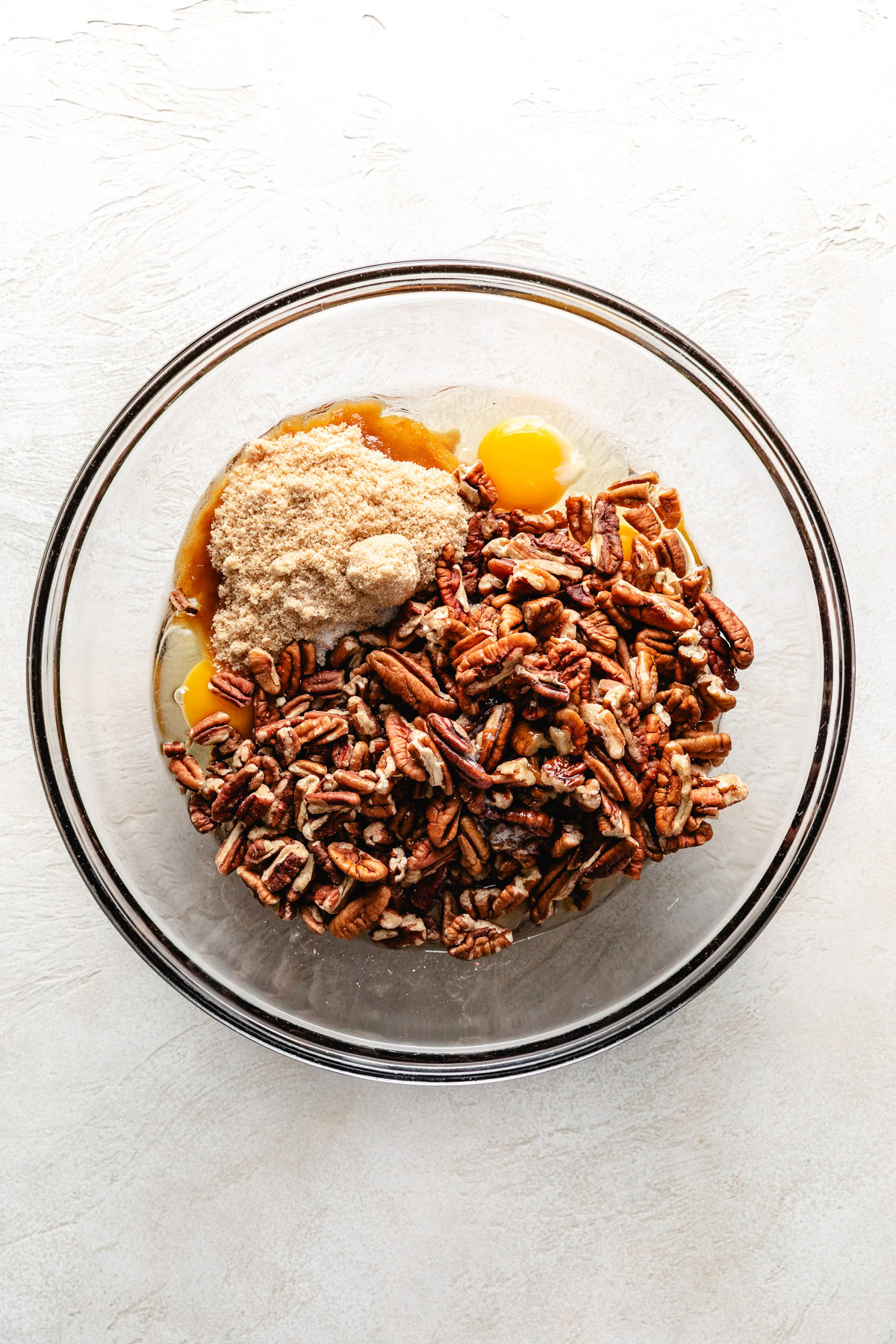 Ingredients for pecan pie in a bowl.