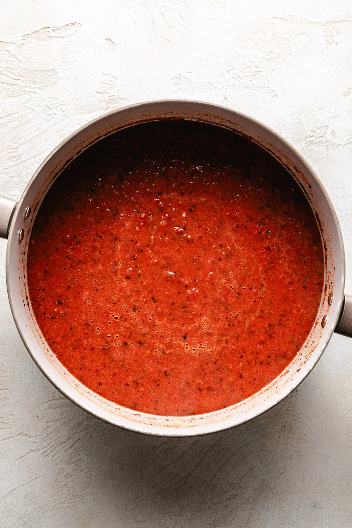 Blended tomato soup in a pan.