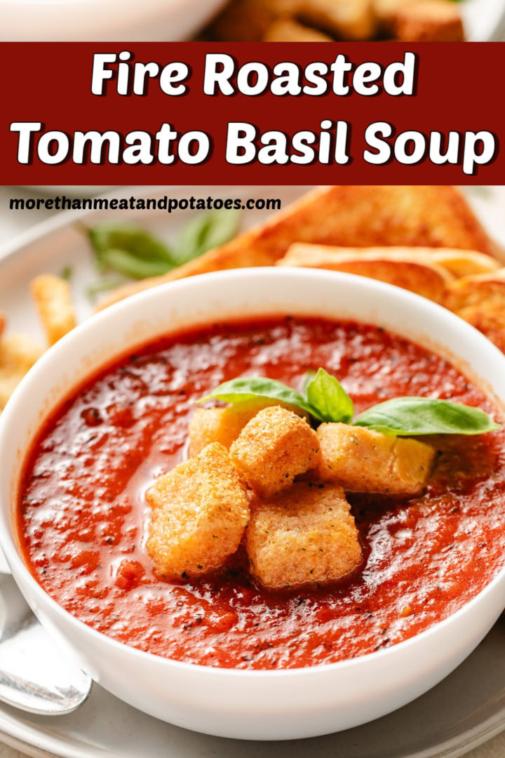 White bowl filled with tomato basil soup.