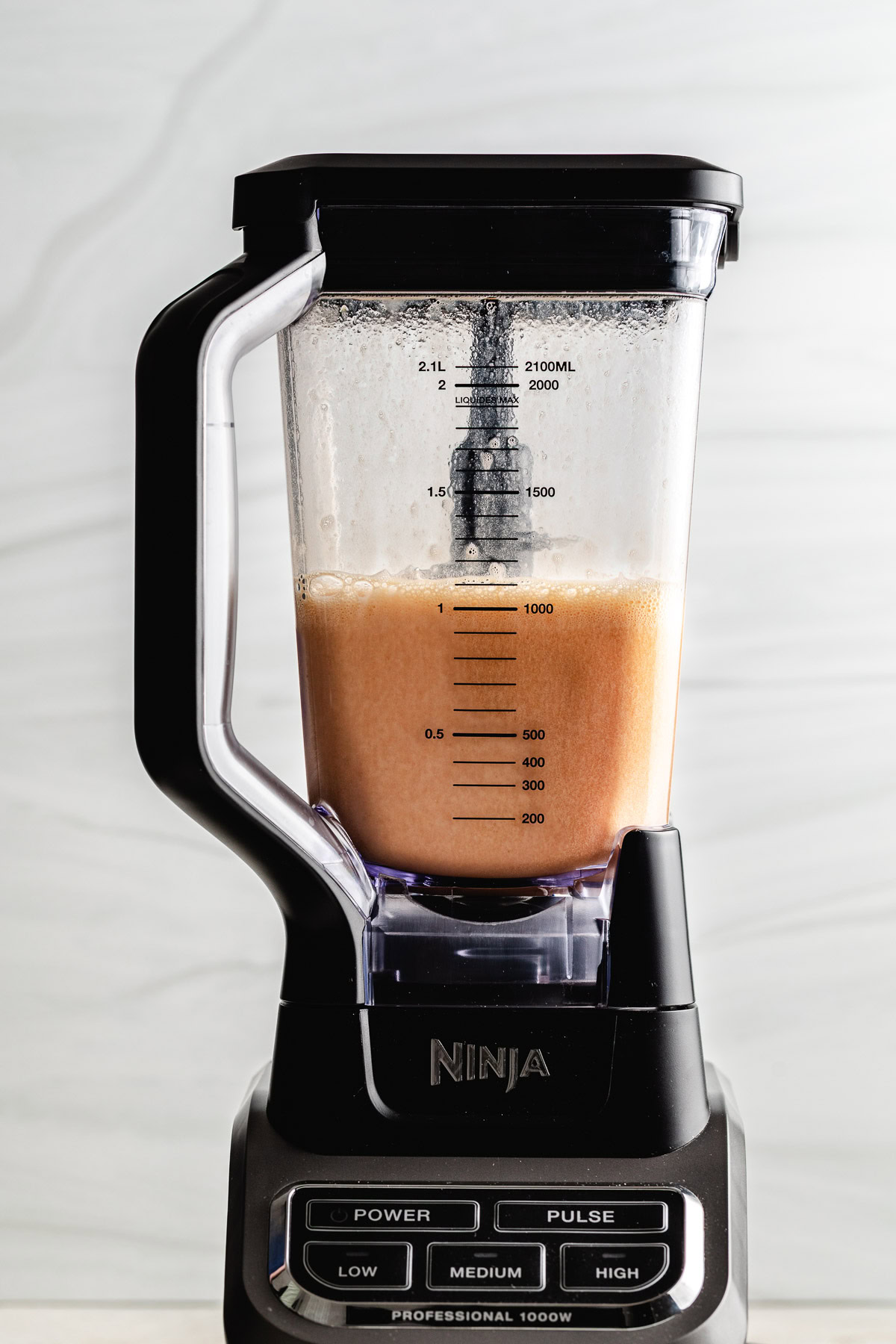 Cranberry juice and orange concentrate mixed in a blender.