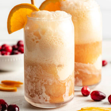 Close up view of cranberry orange ice cream soda.