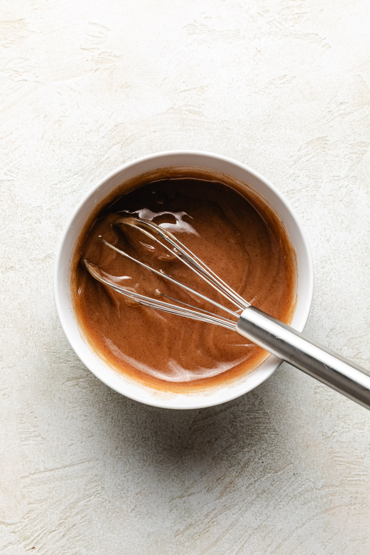 Pan with a whisk and honey butter glaze.