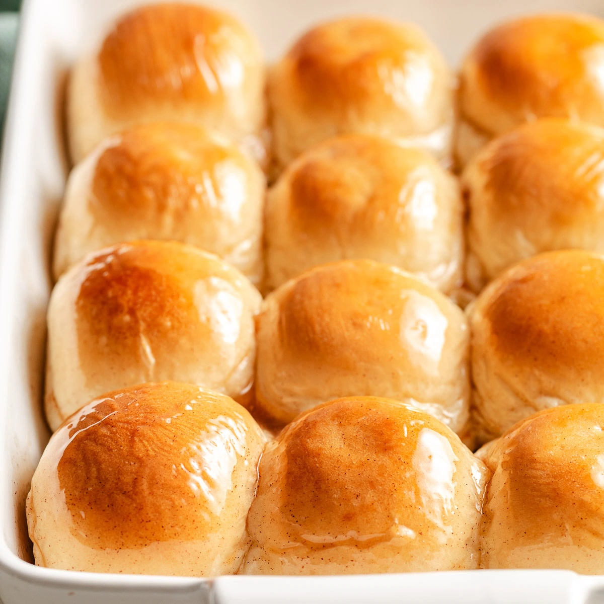 Close up view of honey butter rolls in a pan.