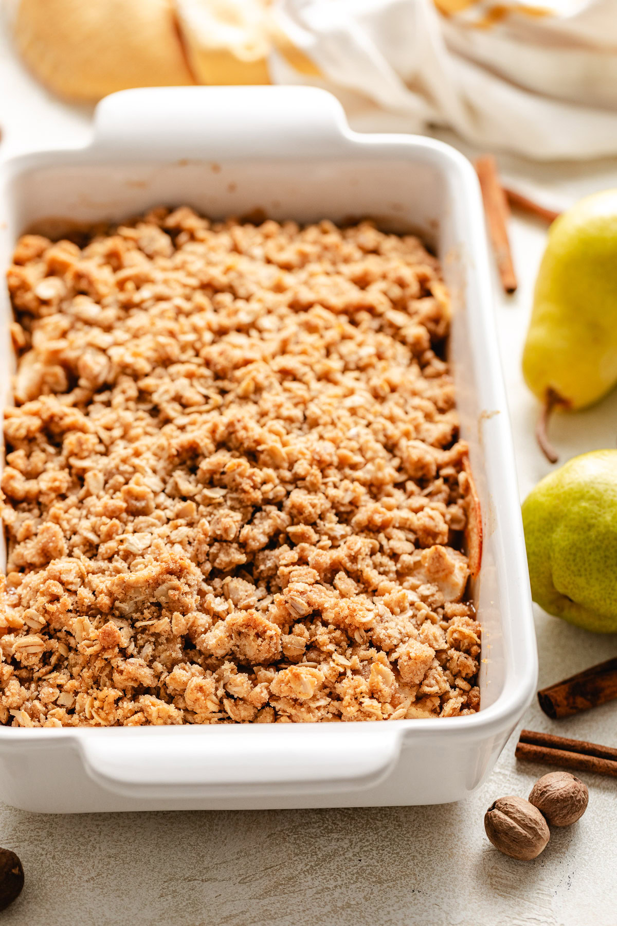 Pan of pear crisp with crumble topping.