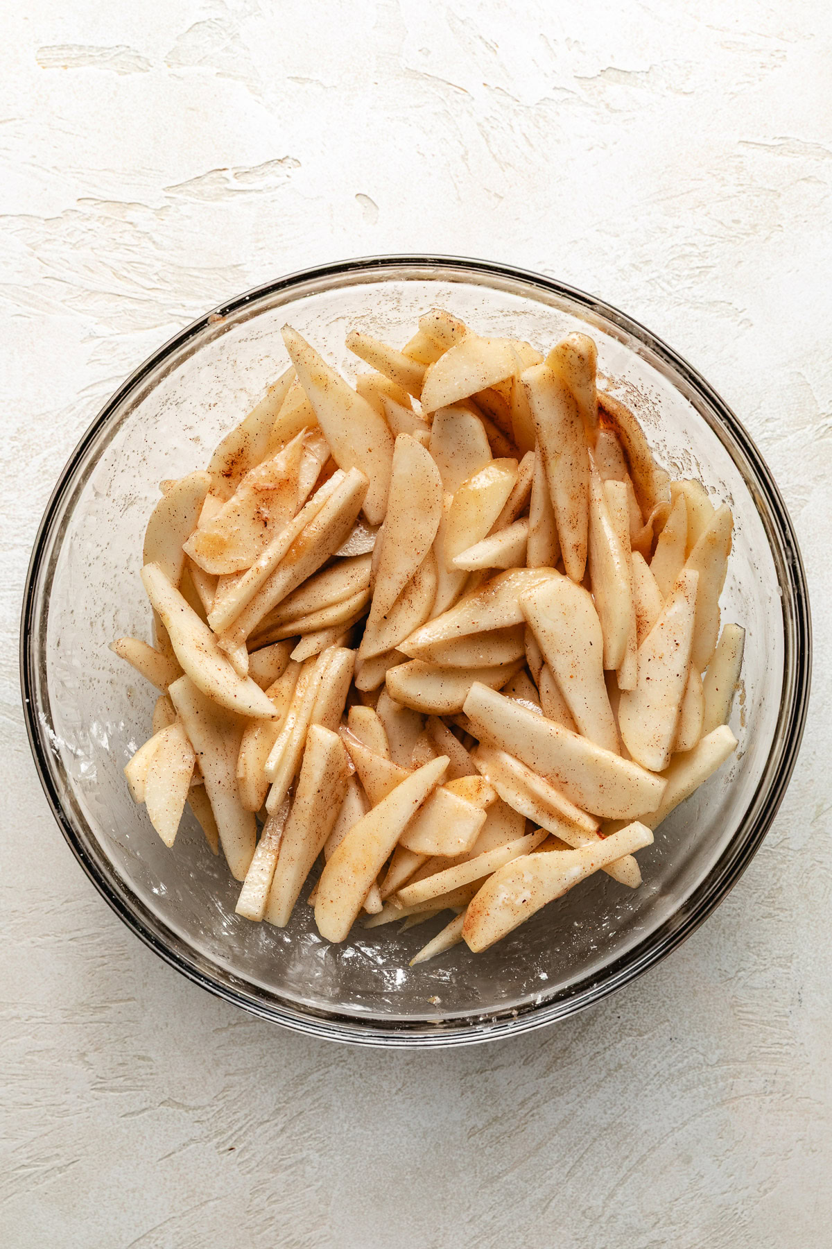Spiced pear slices in a bowl.