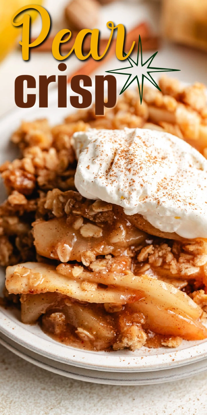 Close up view of pear crisp on a stack of plates.