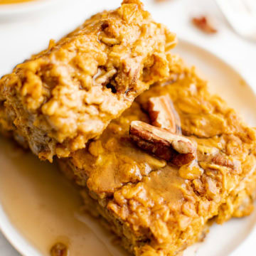 Easy Pumpkin Baked Oatmeal Close up view of syrup and pecans on pumpkin baked oatmeal.