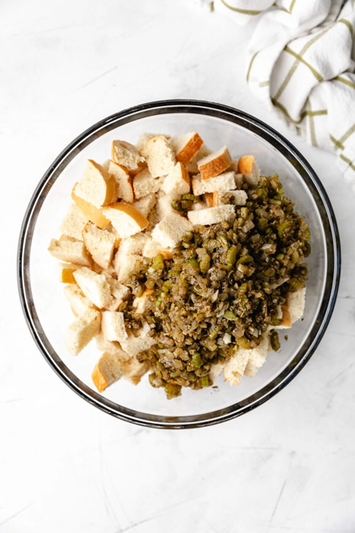 Seasoned vegetables added to dried bread.