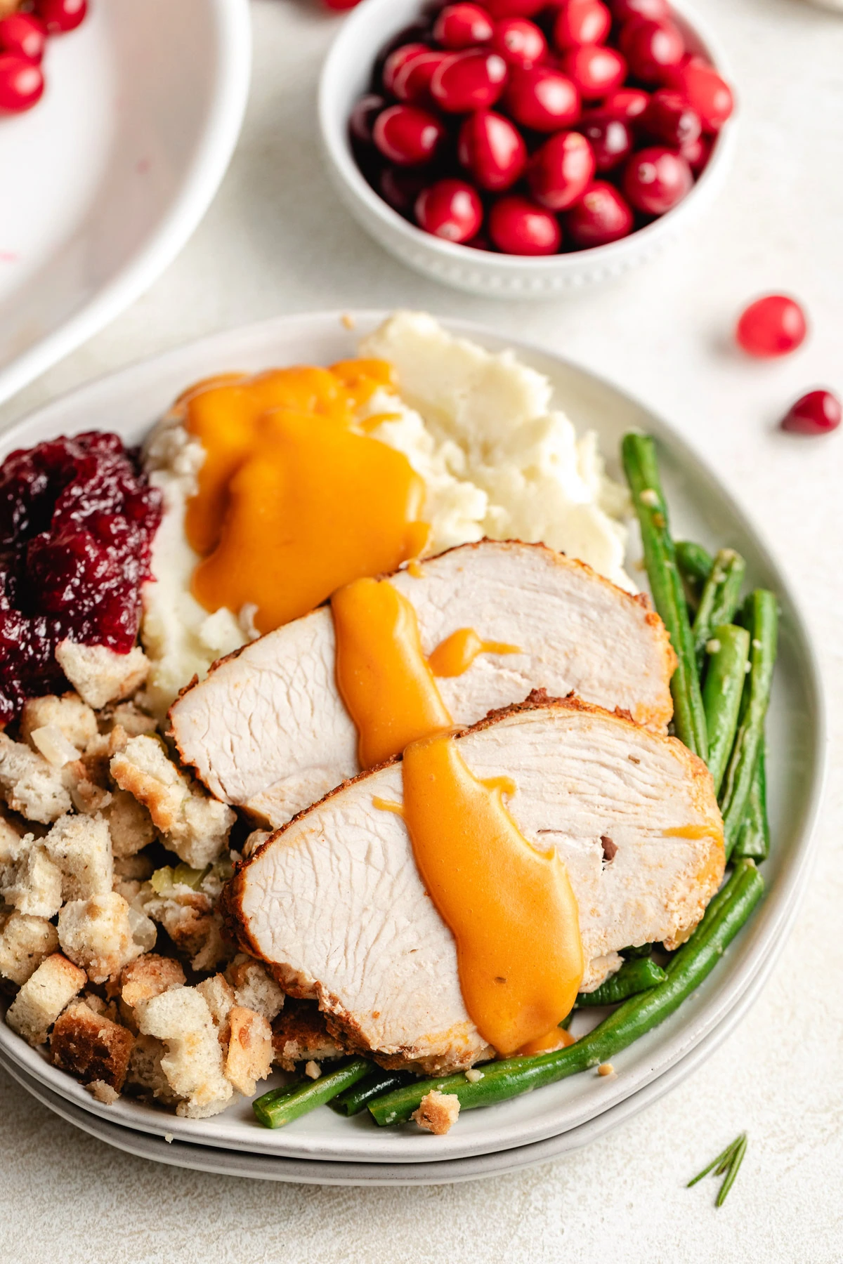 Overhead view of cajun turkey breast with sides.