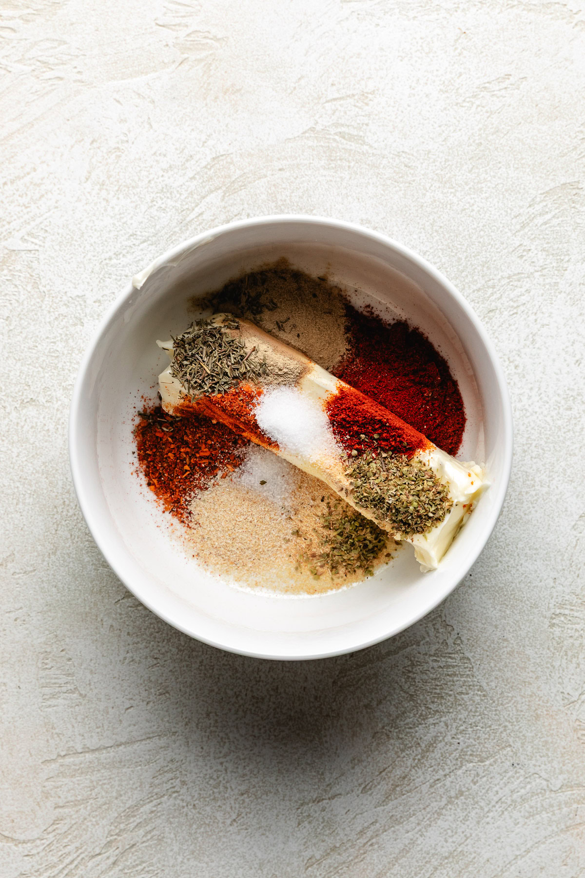 Ingredients for cajun compound butter in a bowl.