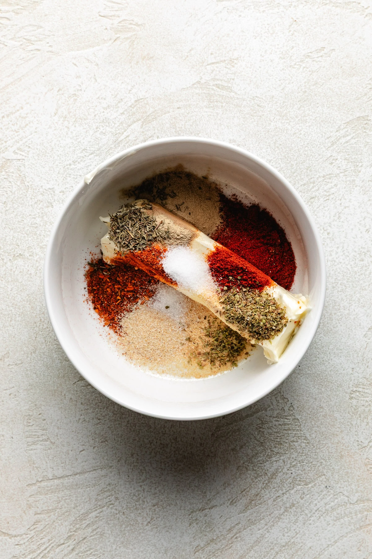Ingredients for cajun compound butter in a bowl.