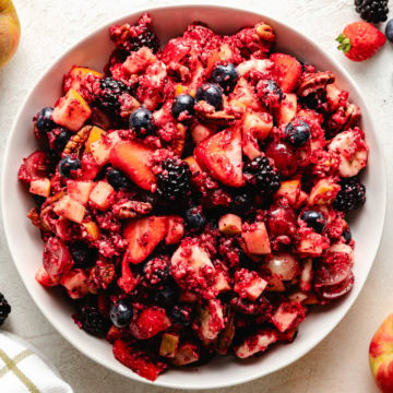 Easy Cranberry Fruit Salad White dish full of cranberry fruit salad.