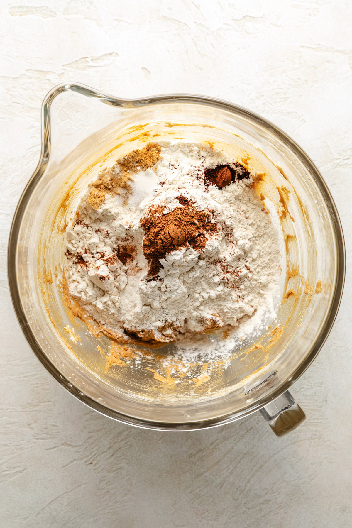 Soft And Chewy Ginger Cookies Mixing ingredients for ginger cookies.