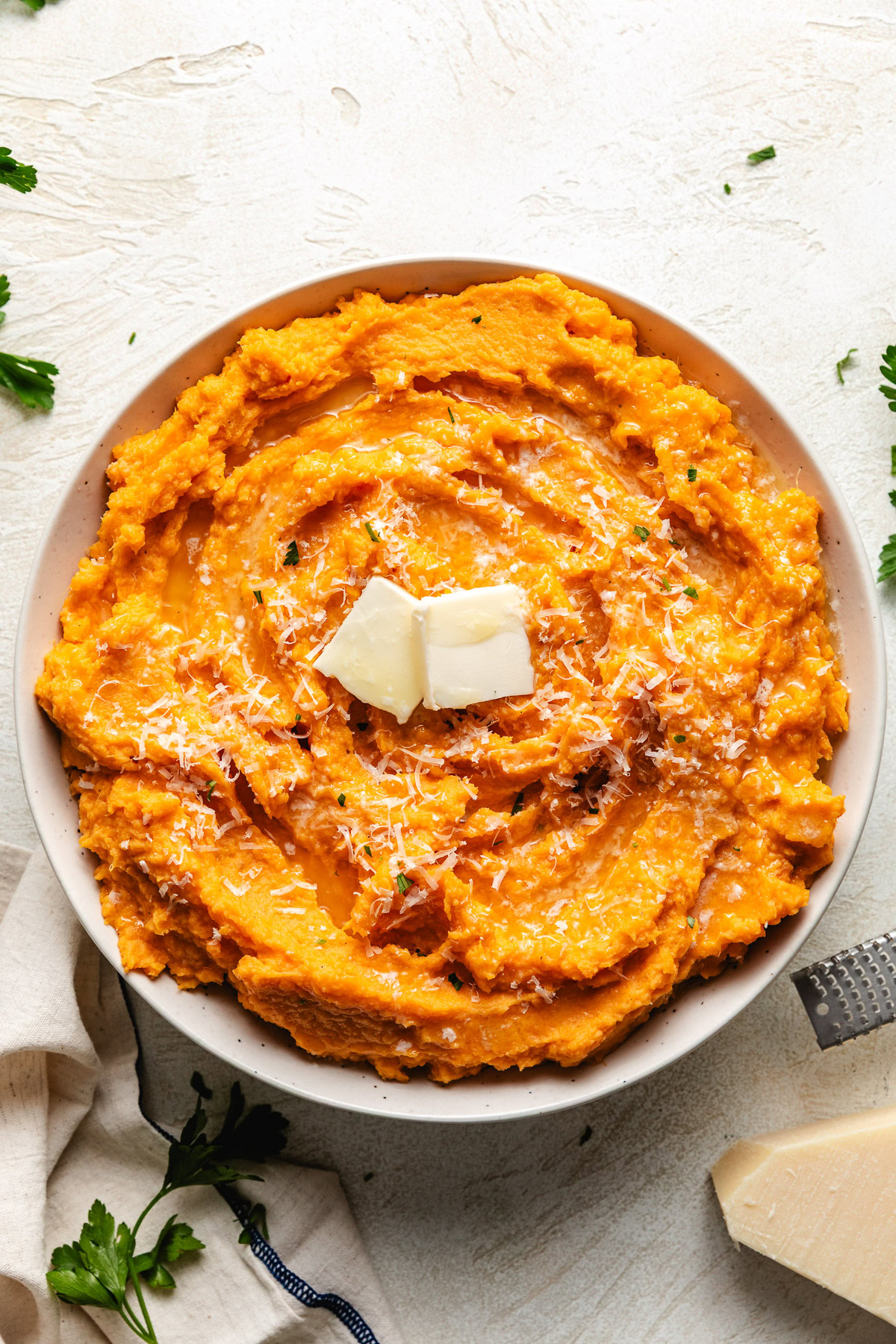 Savory mashed sweet potatoes in a serving dish.