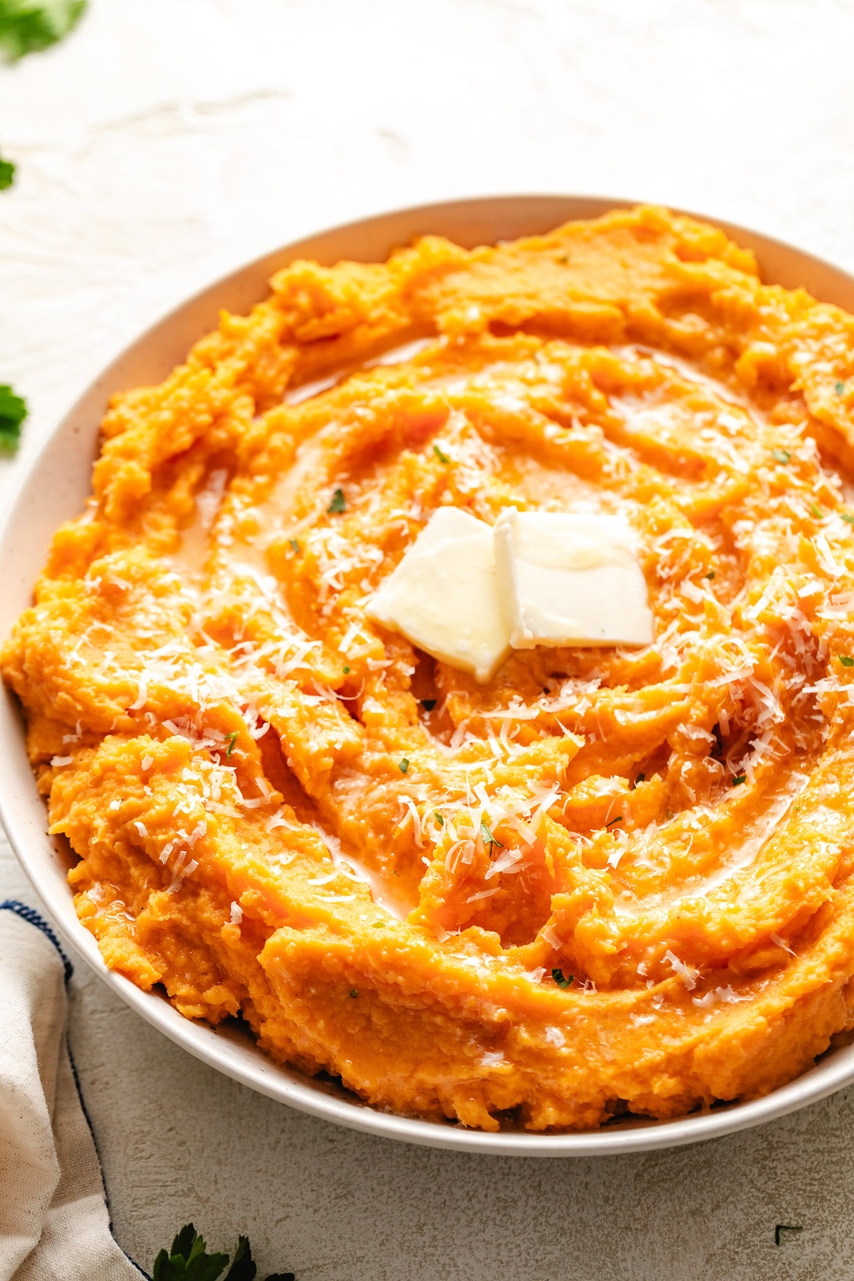 Pats of butter on savory potatoes.