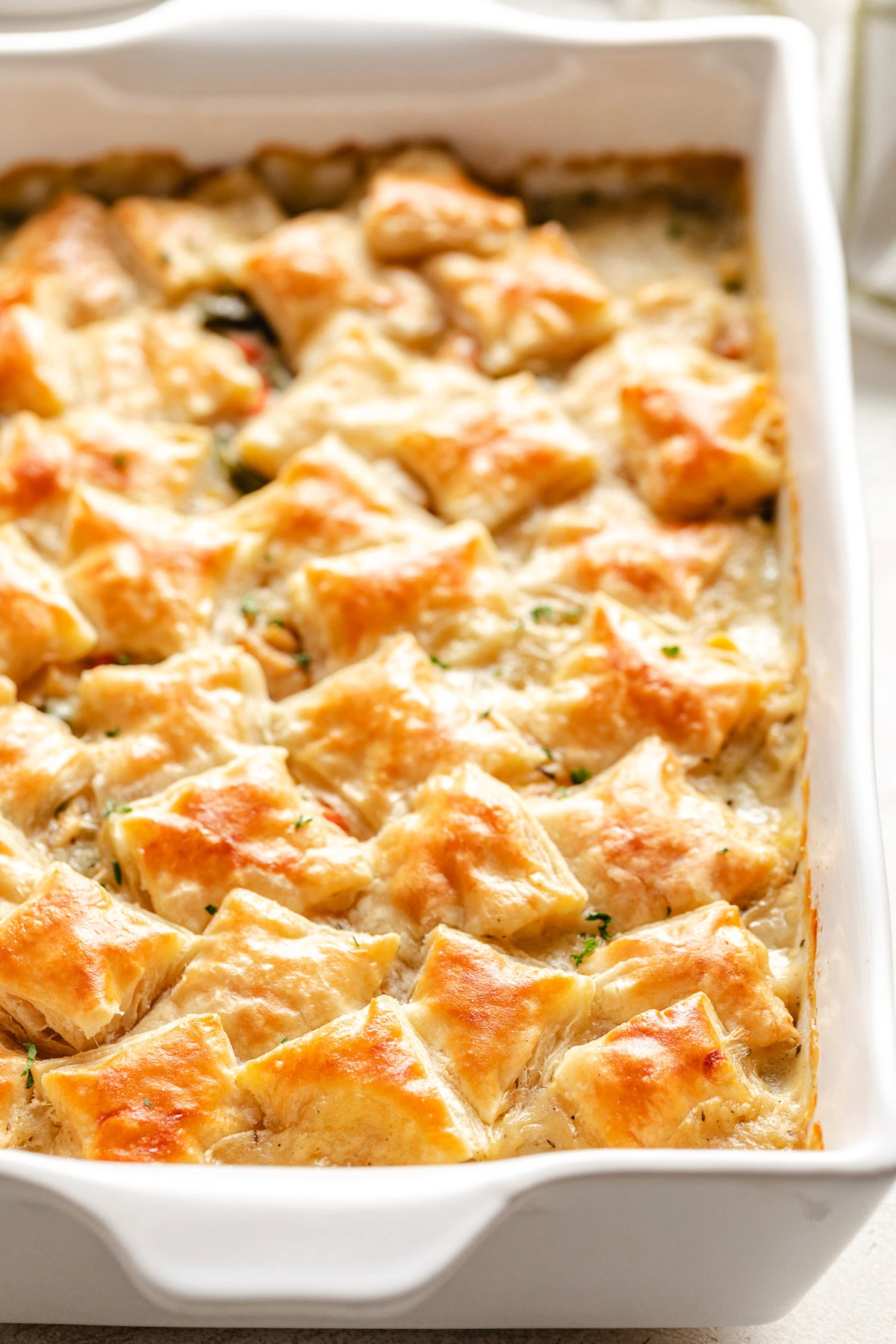 Pot pie in a white baking pan.