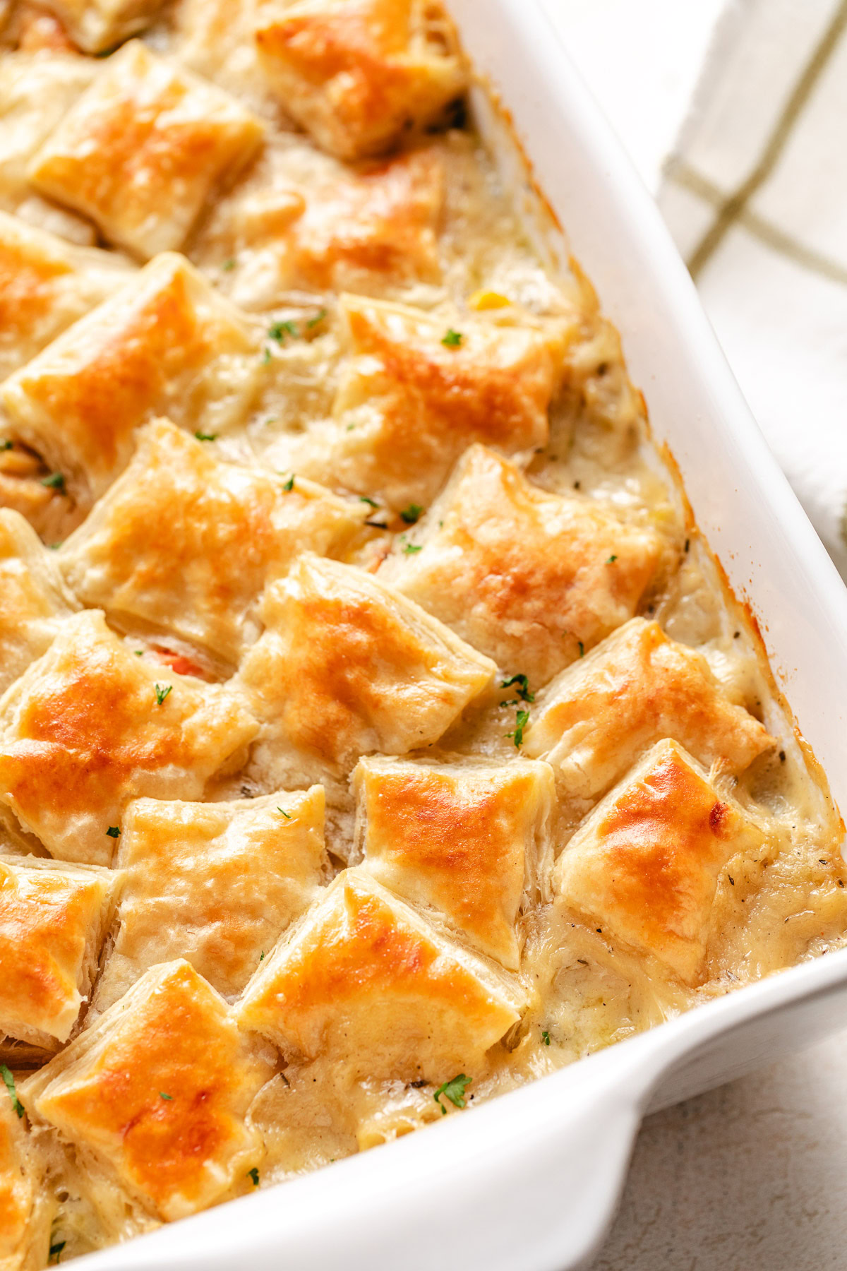 Turkey pot pie in a white pan.
