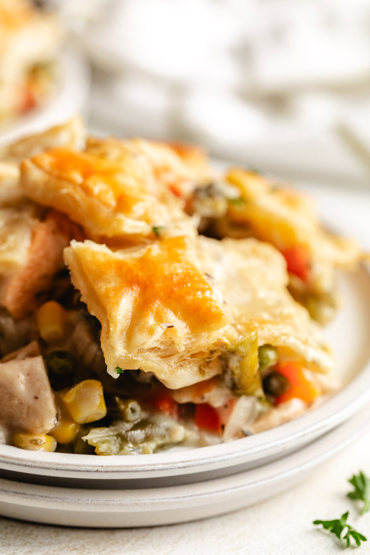 Turkey pot pie with puff pastry and veggies.