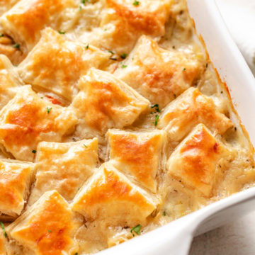 Close up view of turkey pot pie with puff pastry.