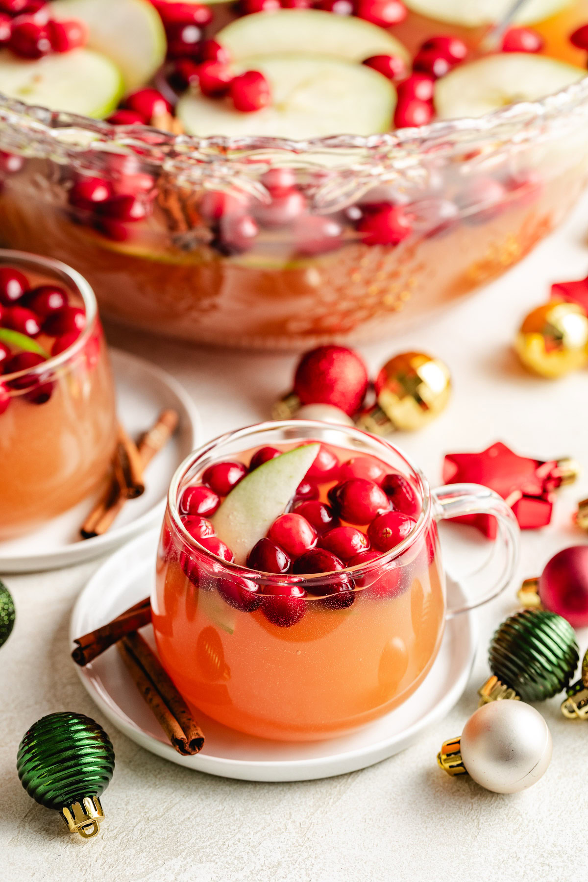 Easy Cranberry Christmas Punch Apple slice and cranberries in cranberry christmas punch.