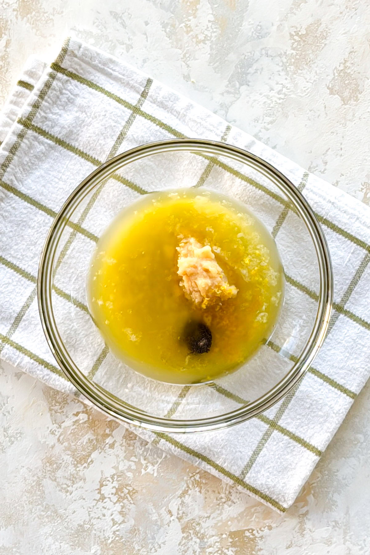 Lemon Garlic Butter Baked Cod Bowl with lemon juice, garlic paste, and seasonings.