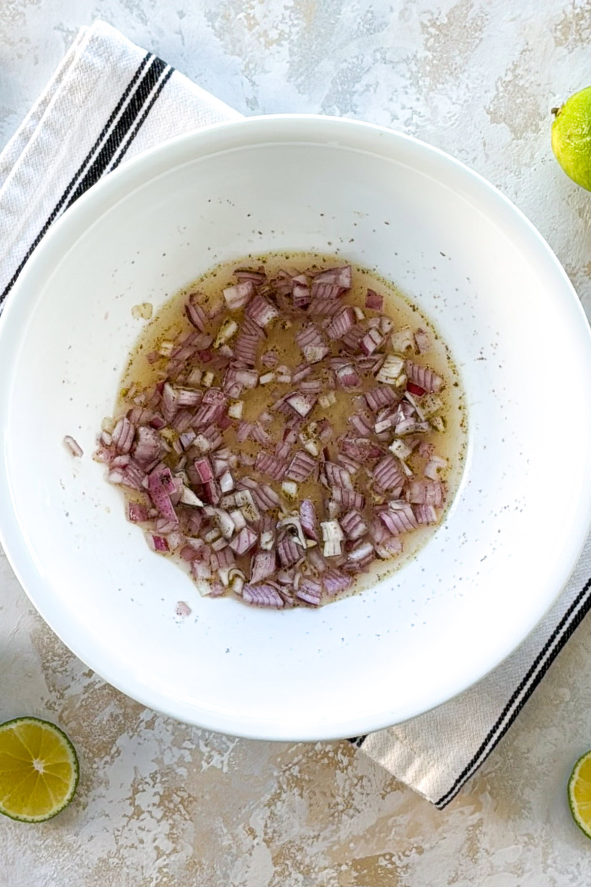 Lime juice and olive oil dressing with chopped red onion.