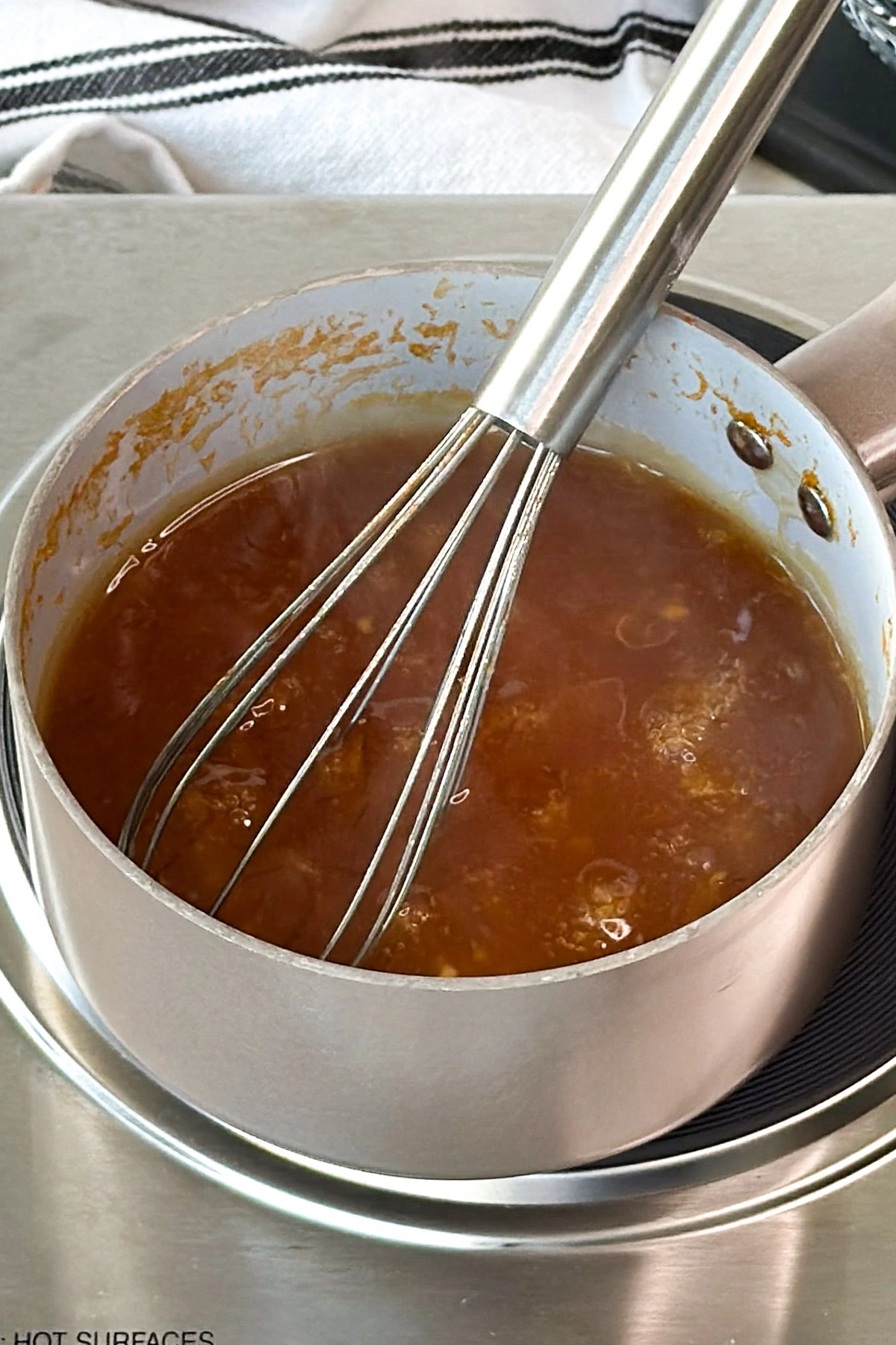 Sauce simmering in a pot.