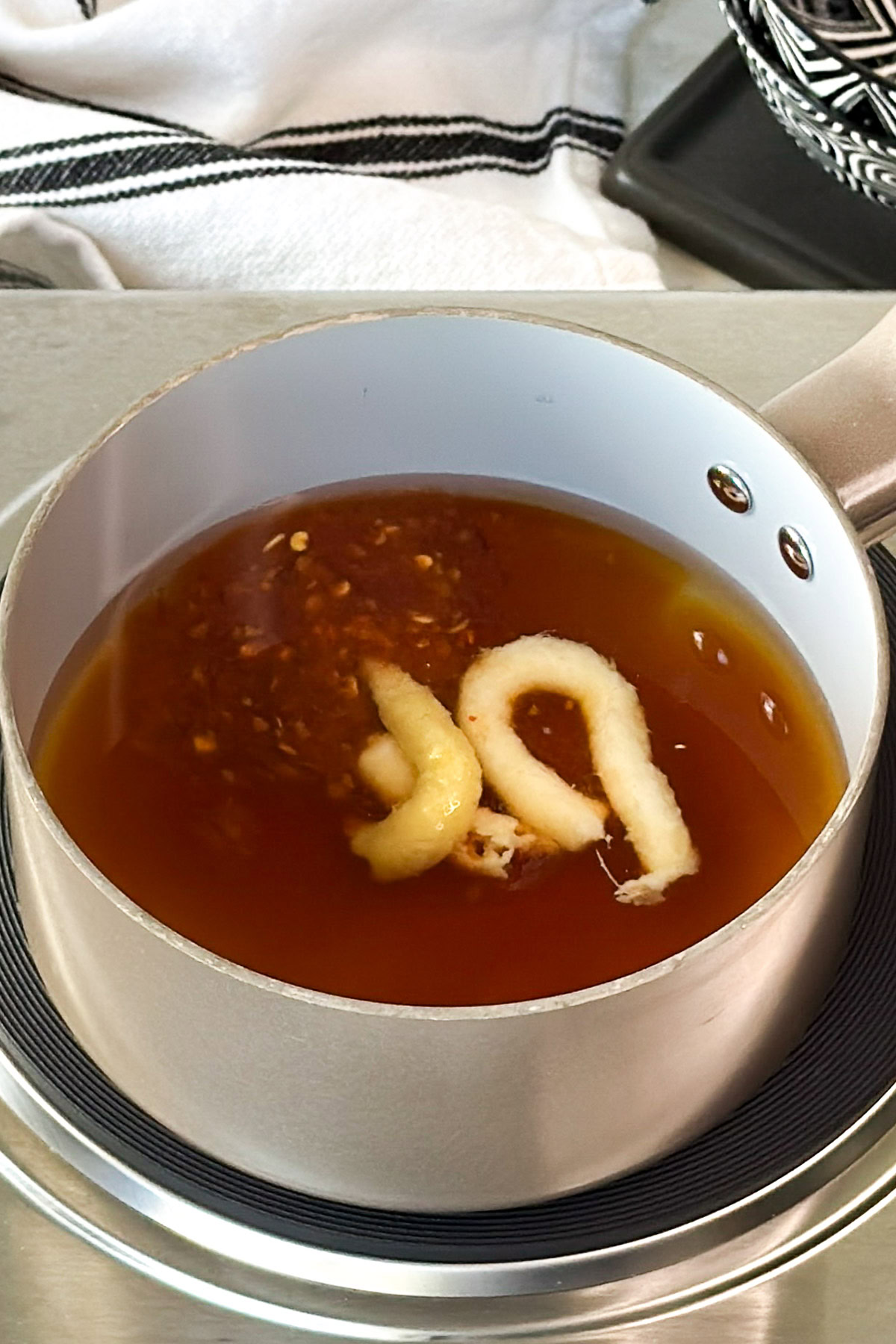 Sauce simmering with ginger and garlic paste.
