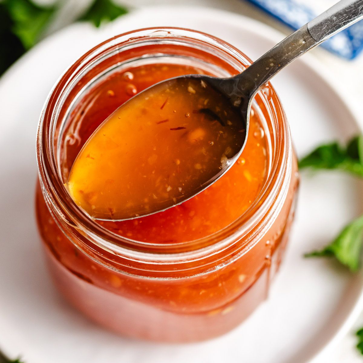 Chili sauce with spoon.