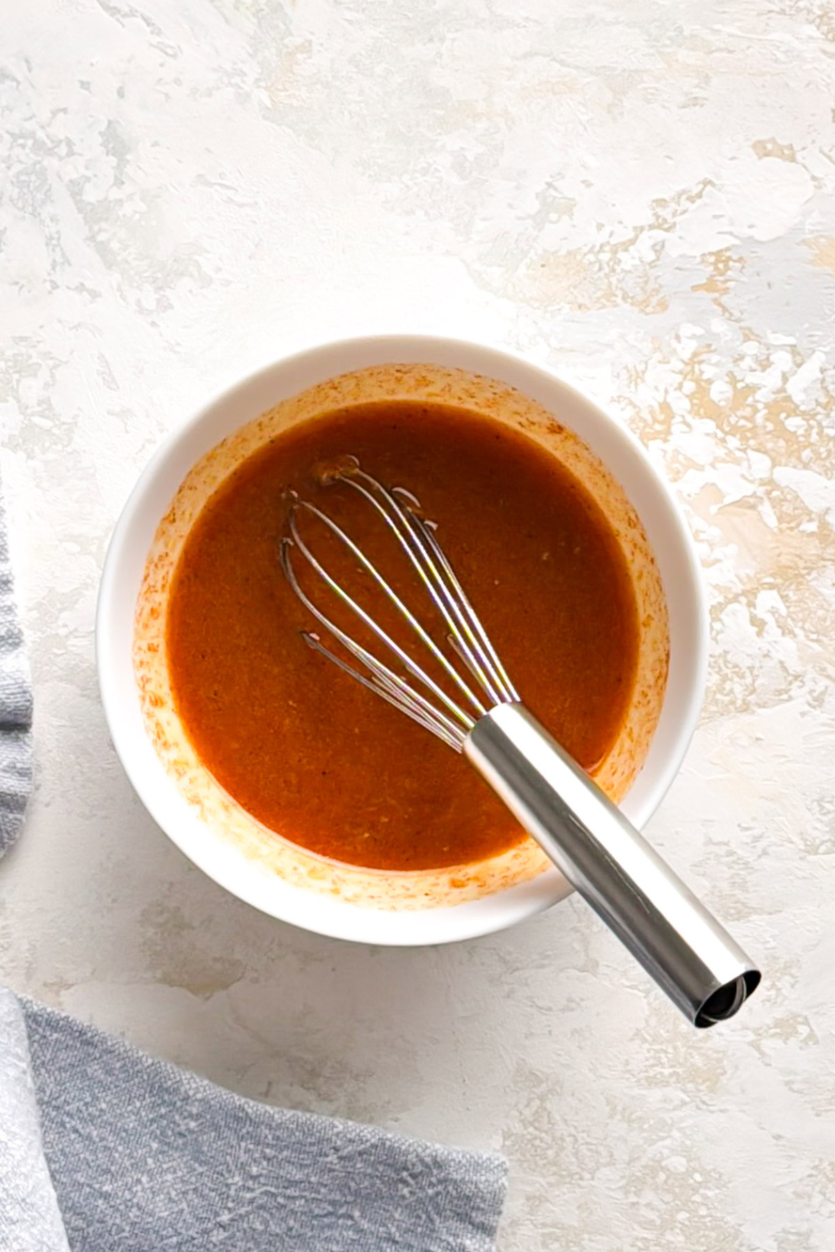 Garlic lemon butter with paprika in a bowl.