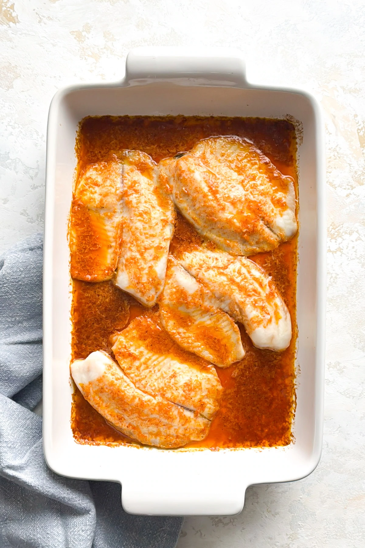 Overhead view of baked tilapia.