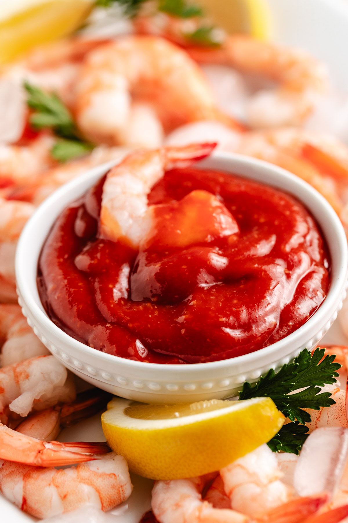 Close up of thick shrimp cocktail sauce in a white bowl.