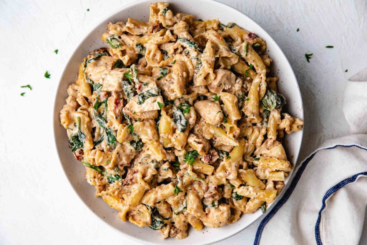 Overhead view of a plate of Tuscan Chicken Pasta.