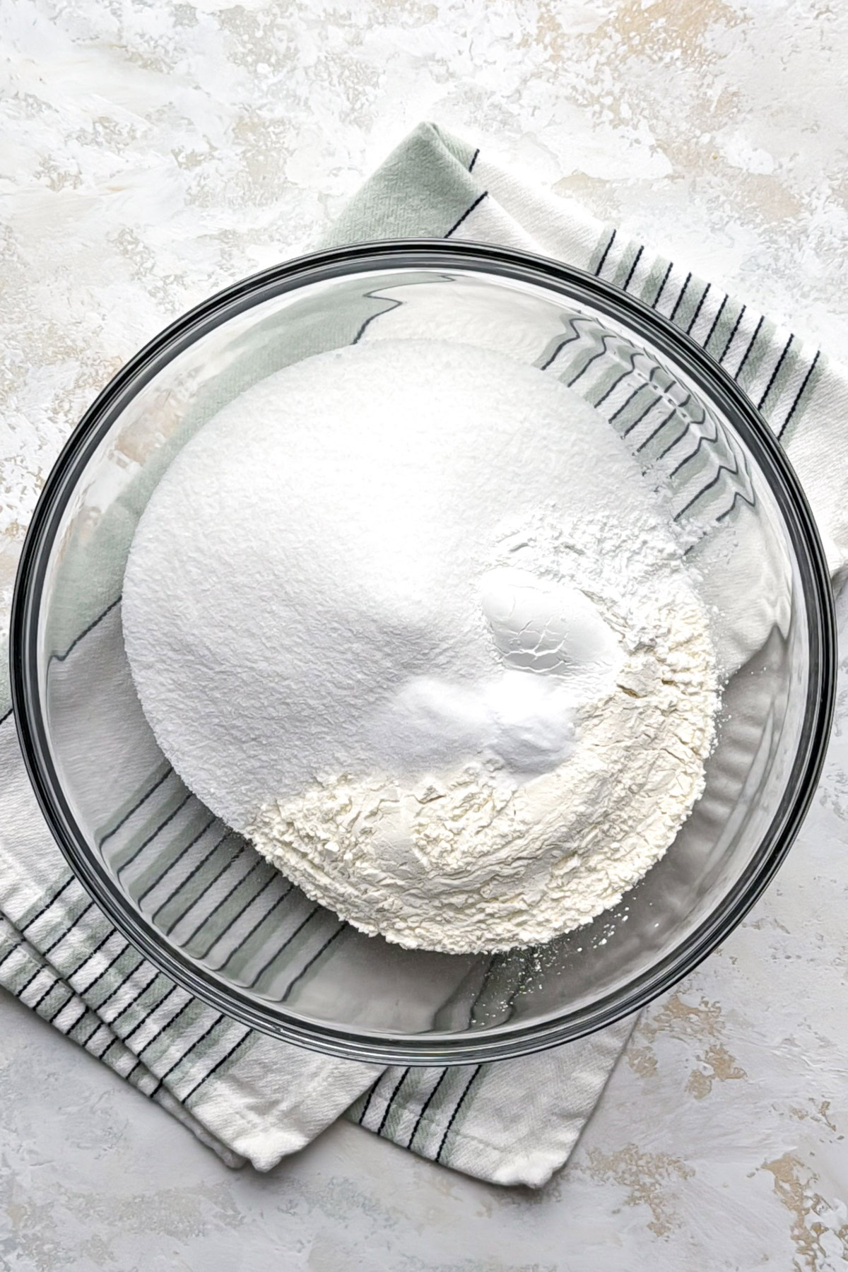 Dry ingredients in a glass mixing bowl.